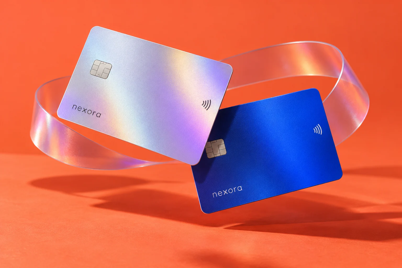 Nexora silver and blue card concepts on a vibrant coral setting